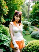 A woman in an orange and white outfit posing for a picture.