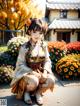 A woman in a kimono sitting on the ground in front of flowers.